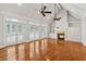 Bright living area features hardwood floors, fireplace, French doors, built-ins, and vaulted ceilings at 220 Spring Branch Dr, Canton, GA 30115