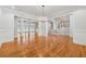 Open living room with hardwood floors, recessed lighting, a chandelier and staircase at 220 Spring Branch Dr, Canton, GA 30115