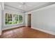 Light-filled sunroom with tile flooring and large windows offering serene outdoor views at 220 Spring Branch Dr, Canton, GA 30115