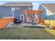 The back yard offers a patio with pergola and plenty of space for play at 3210 Ancoats St, Douglasville, GA 30135
