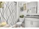 A well-lit bathroom featuring elegant accents and a minimalist shower at 3210 Ancoats St, Douglasville, GA 30135