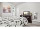 Comfortable bedroom featuring a scenic painting, television, and a reading nook at 3210 Ancoats St, Douglasville, GA 30135