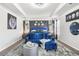 Luxurious bedroom featuring a stylish blue sofa, a comfortable bed, and chic decor for a relaxing retreat at 3210 Ancoats St, Douglasville, GA 30135