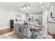 Bright dining area with modern furniture, stainless steel kitchen, and hardwood floors at 3210 Ancoats St, Douglasville, GA 30135
