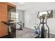 The exercise room features an elliptical machine, stationary bike, and personal sauna at 3210 Ancoats St, Douglasville, GA 30135