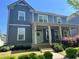 Charming two-story home with a welcoming front porch and manicured landscaping at 3210 Ancoats St, Douglasville, GA 30135