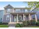 Charming two-story home features a welcoming front porch and beautifully landscaped front yard at 3210 Ancoats St, Douglasville, GA 30135