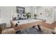 Air hockey table with unique wood design, patterned rug, and decorative boombox art at 3210 Ancoats St, Douglasville, GA 30135