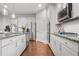 Modern kitchen with stainless steel appliances, a kitchen island, and sleek countertops at 3210 Ancoats St, Douglasville, GA 30135