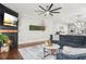 Bright and airy living room featuring a modern fireplace, comfortable seating, and stylish decor with an open concept layout at 3210 Ancoats St, Douglasville, GA 30135