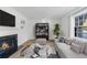 Spacious living room featuring a fireplace and built-in shelving at 10 Chaumont Nw Sq, Atlanta, GA 30327