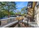 Private patio with outdoor seating and tennis court view at 10 Chaumont Nw Sq, Atlanta, GA 30327