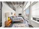 Bright bedroom with high ceilings, a mezzanine, and large windows with a view of the balcony at 572 Edgewood Ne Ave # 306, Atlanta, GA 30312