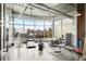 Bright gym featuring multiple cardio machines, free weights, and large windows with outside views at 572 Edgewood Ne Ave # 306, Atlanta, GA 30312