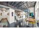 Modern open-concept living area with a spiral staircase, dining area, and stylish kitchen at 572 Edgewood Ne Ave # 306, Atlanta, GA 30312