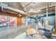 Modern lobby seating area featuring exposed ductwork, chairs, tables, rug, and stylish decor at 572 Edgewood Ne Ave # 306, Atlanta, GA 30312