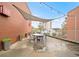 Spacious rooftop patio with shade covering, dining table, and city views with surrounding brick walls at 572 Edgewood Ne Ave # 306, Atlanta, GA 30312