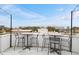 Charming rooftop patio with string lights, tables, and chairs, offering a relaxing outdoor space with a great view at 572 Edgewood Ne Ave # 306, Atlanta, GA 30312