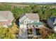 Aerial view of a home showcasing its backyard, landscaping, and proximity to surrounding trees at 3213 Blackley Old, Douglasville, GA 30135