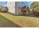 Backyard view of the deck with a spacious grassy area at 3213 Blackley Old, Douglasville, GA 30135