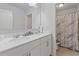 Bathroom featuring a dual sink vanity and shower with marble design curtain at 3213 Blackley Old, Douglasville, GA 30135