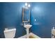 Powder room with dark walls, pedestal sink, and toilet at 3213 Blackley Old, Douglasville, GA 30135