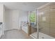 Bright bathroom featuring a shower, tub, and natural light at 3213 Blackley Old, Douglasville, GA 30135