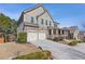 Beautiful two-story home with stone accents, neutral siding, manicured landscaping, and a two-car garage at 3213 Blackley Old, Douglasville, GA 30135