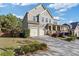 Beautiful two-story home with a large driveway and well-manicured front yard at 3213 Blackley Old, Douglasville, GA 30135