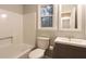 Clean bathroom with a tub shower combo and updated vanity at 100 Lakeside Dr, Covington, GA 30016