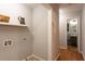 Convenient laundry area with built in shelving at 100 Lakeside Dr, Covington, GA 30016