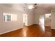 Open living room with hardwood floors and access to the kitchen at 100 Lakeside Dr, Covington, GA 30016