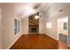 Living room featuring a stone fireplace and hardwood flooring at 100 Lakeside Dr, Covington, GA 30016