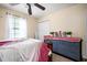 Bedroom featuring a dresser with a mirror and a queen-sized bed with blankets at 1236 Country Pine Dr, Ellenwood, GA 30294
