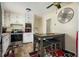 Efficient kitchen with stainless steel appliances, bright lighting, and an adjacent dining area at 1236 Country Pine Dr, Ellenwood, GA 30294