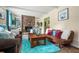 Inviting living room featuring a stone fireplace, comfortable seating, and bright natural light at 1236 Country Pine Dr, Ellenwood, GA 30294