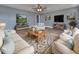 Inviting living room featuring neutral walls, plank flooring, comfortable seating, and a cozy rug, creating a relaxing atmosphere at 76 Townsend Teague Ne Rd, Fairmount, GA 30139