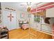 Bedroom features wood floors, bunk bed, closet, and workspace at 160 Cross Rd, Covington, GA 30016