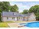 House exterior view showing gray siding, gray roof, and a pool at 160 Cross Rd, Covington, GA 30016