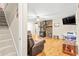 Cozy living room with fireplace, hardwood floors, comfortable furniture, and wall-mounted TV at 160 Cross Rd, Covington, GA 30016