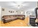 Large living room with hardwood floors, comfortable seating, and a view to the backyard at 160 Cross Rd, Covington, GA 30016