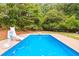 A beautiful inground pool with slide and basketball hoop at 160 Cross Rd, Covington, GA 30016
