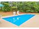 Sparkling in-ground pool with slide and basketball hoop for summer fun at 160 Cross Rd, Covington, GA 30016