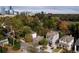 Scenic aerial view of homes in a tree-lined neighborhood with a cityscape backdrop at 2941 Lookout Ne Pl, Atlanta, GA 30305