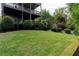 Lush green lawn in the backyard with multiple decks that are attached to the house at 2941 Lookout Ne Pl, Atlanta, GA 30305