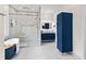 Bright bathroom with a large glass shower, marble tiling, and floating vanity at 2941 Lookout Ne Pl, Atlanta, GA 30305