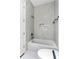 Bathroom with marble tiling, sleek fixtures, and built-in shower niche at 2941 Lookout Ne Pl, Atlanta, GA 30305