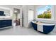 Bathroom features a soaking tub, walk-in shower, and modern vanity at 2941 Lookout Ne Pl, Atlanta, GA 30305
