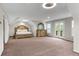 Spacious bedroom with neutral carpet, large windows, and ample space for a king bed and dresser at 2941 Lookout Ne Pl, Atlanta, GA 30305