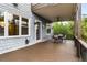 Outdoor patio space features dining table and chairs, along with exterior building details at 2941 Lookout Ne Pl, Atlanta, GA 30305